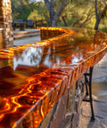 Outdoor stone bar with reflective surface and blurred background