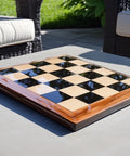 Wooden chessboard on a table outdoors