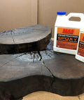 Two bottles of MAS Penetrating Epoxy Sealer on a wooden surface with a brown background