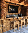 Wooden bar with tiki statues and a TV screen in an outdoor setting